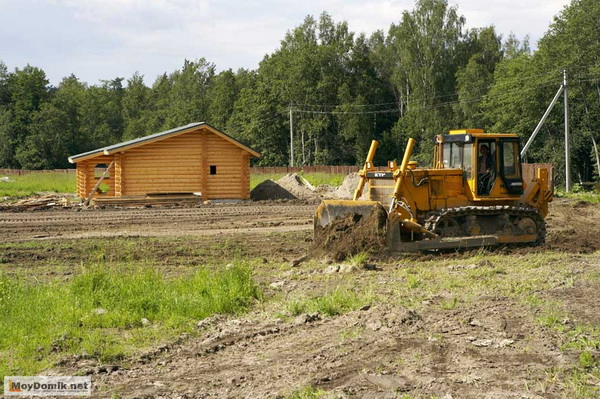 Подготовка земельного участка для строительства дома в фото