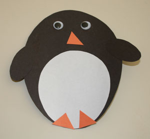 Аппликация из ткани: овальный пингвин в фото